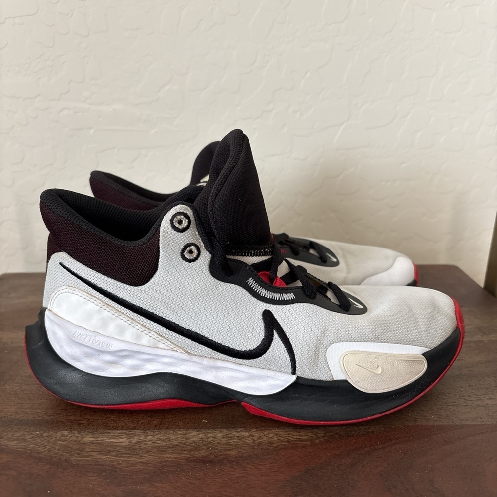 Nike man’s White and Black Sneakers with Red Accents. 8